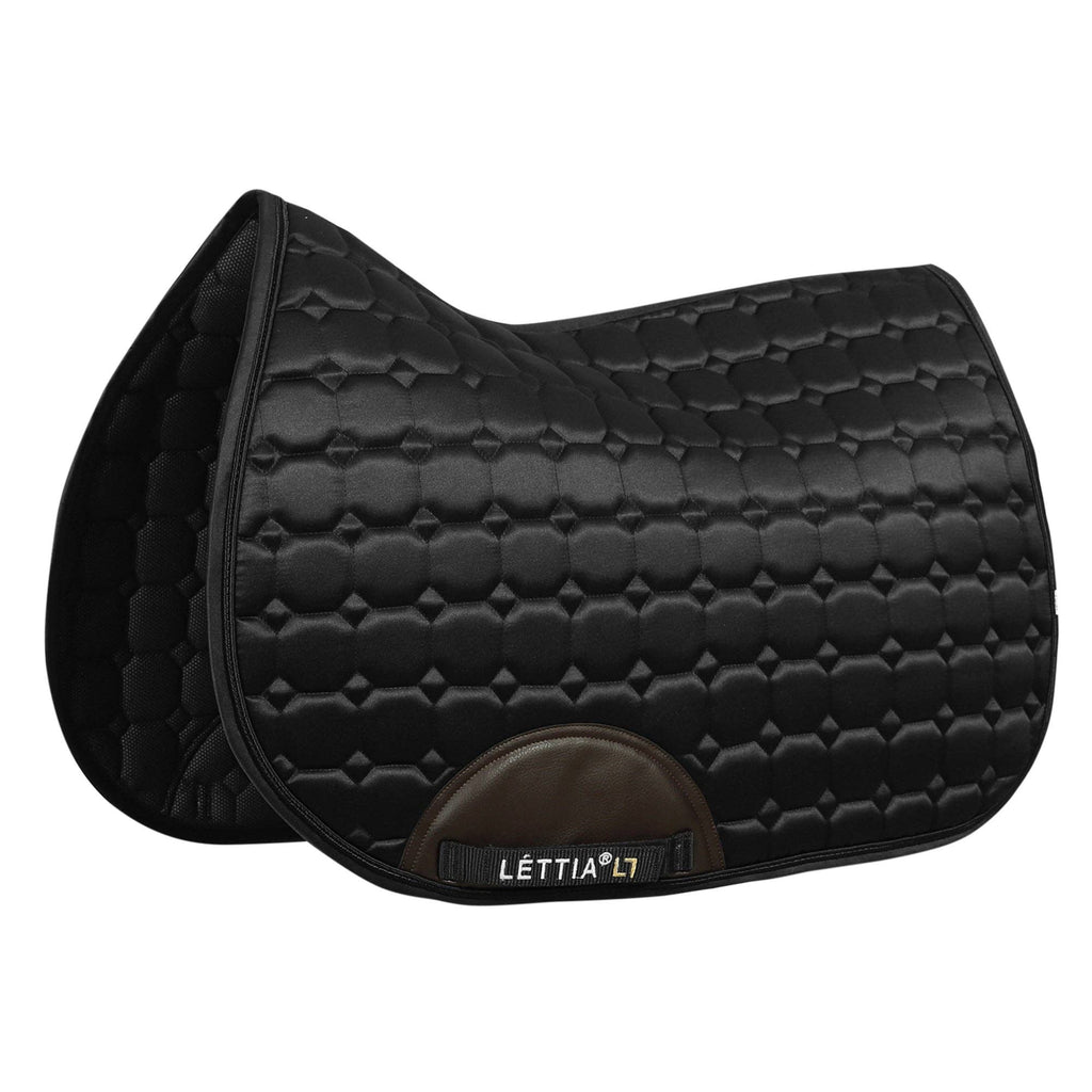 Black quilted saddle pad with brown flap on a white background